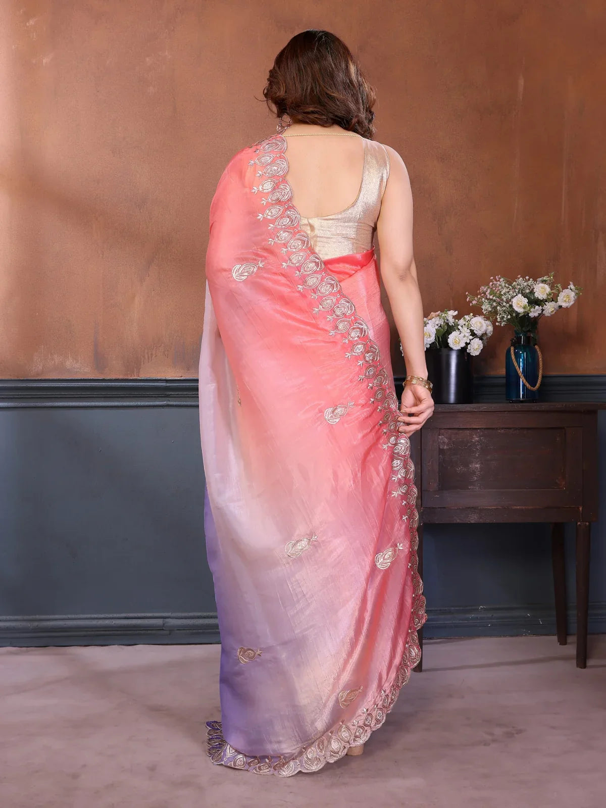 Back view of Tarani gold crush silk saree with soft pastel tones and elegant finish