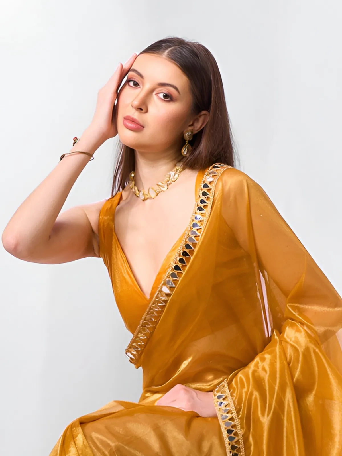 Tarani golden saree with mirror lace border and blouse – upper body pose