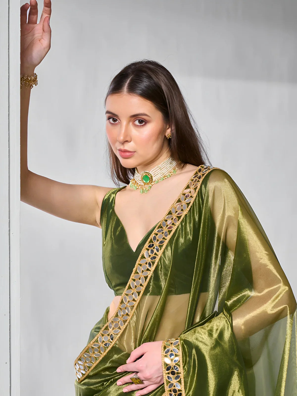 Tarani green saree close-up upper body with shimmering blouse and mirror lace