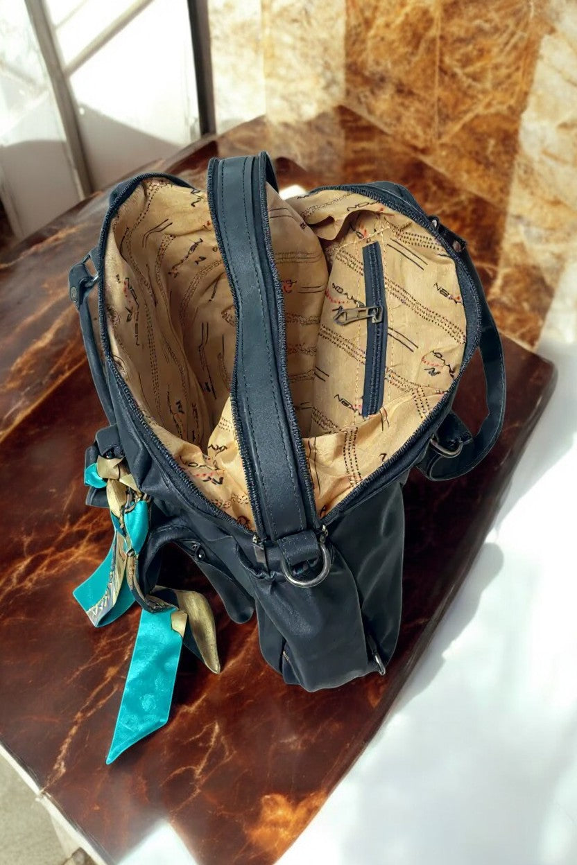 Tarani spacious black PU leather handbag interior view