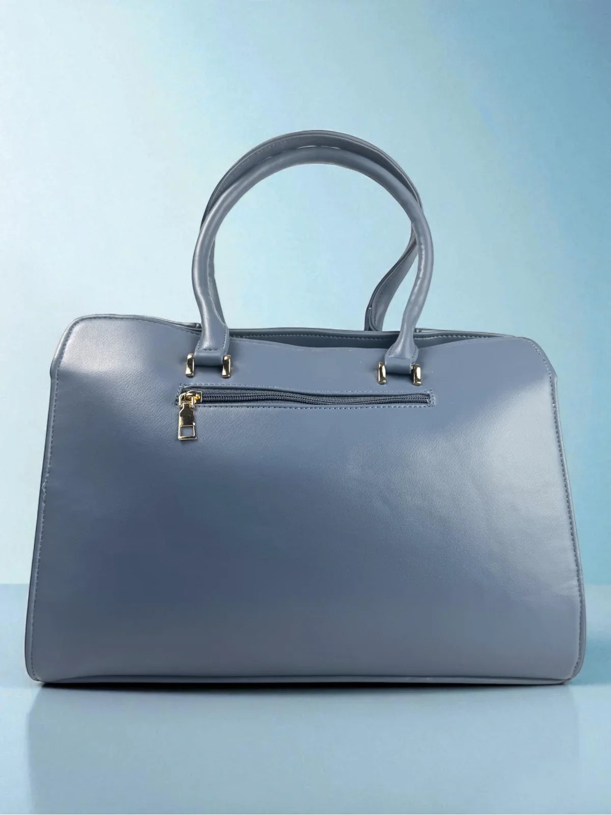 Tarani blue PU leather handbag back view with zip closure versatile for daily use
