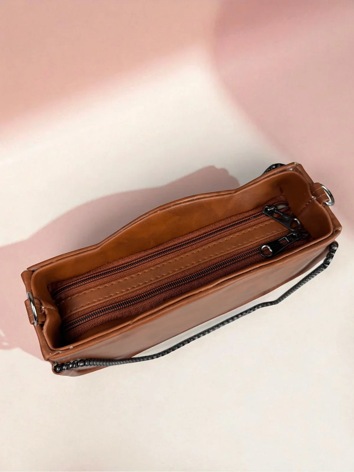 Tarani brown PU leather handbag spacious interior closeup with compartments