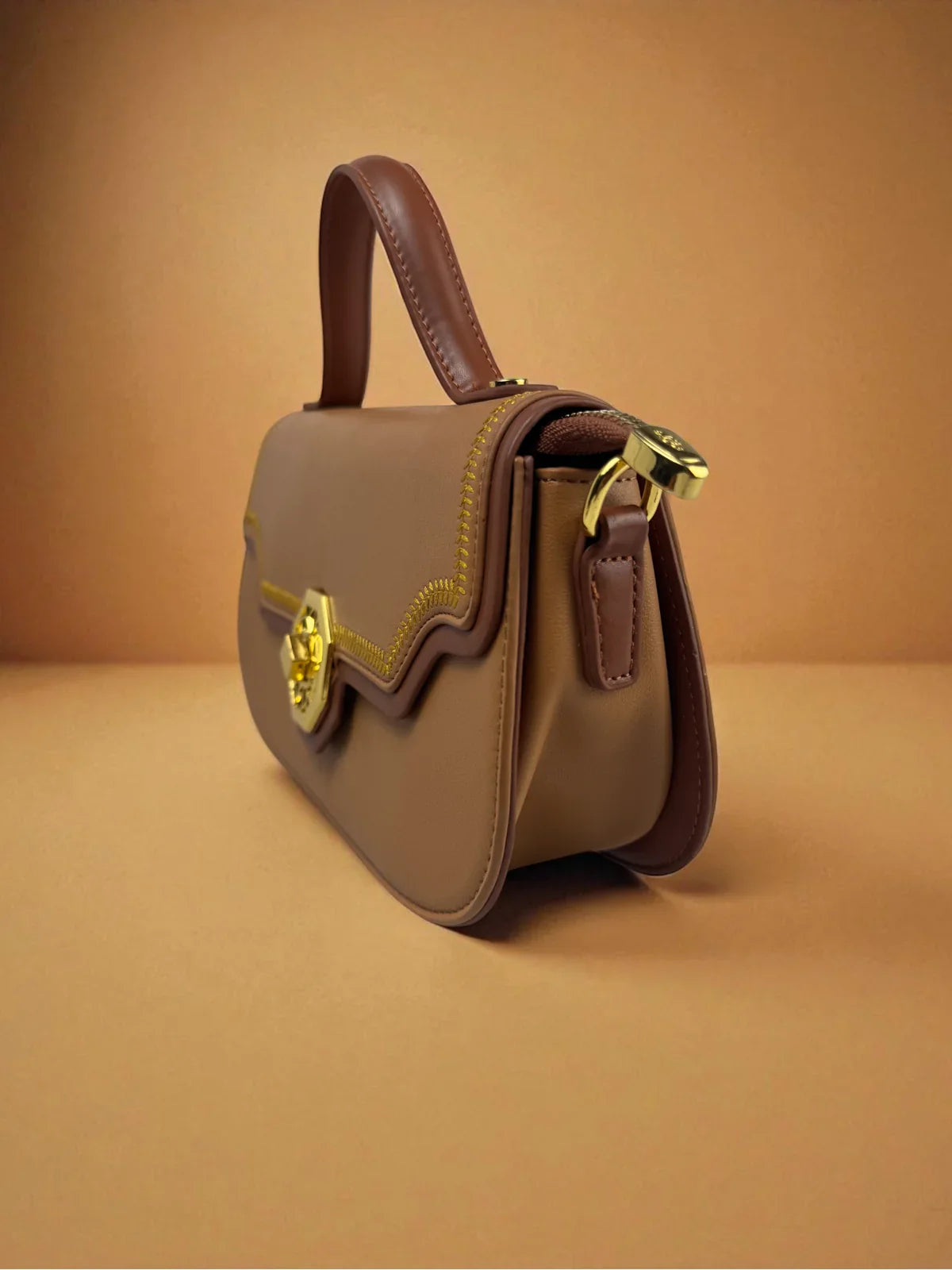 Tarani brown PU leather handbag side view with elegant detailing