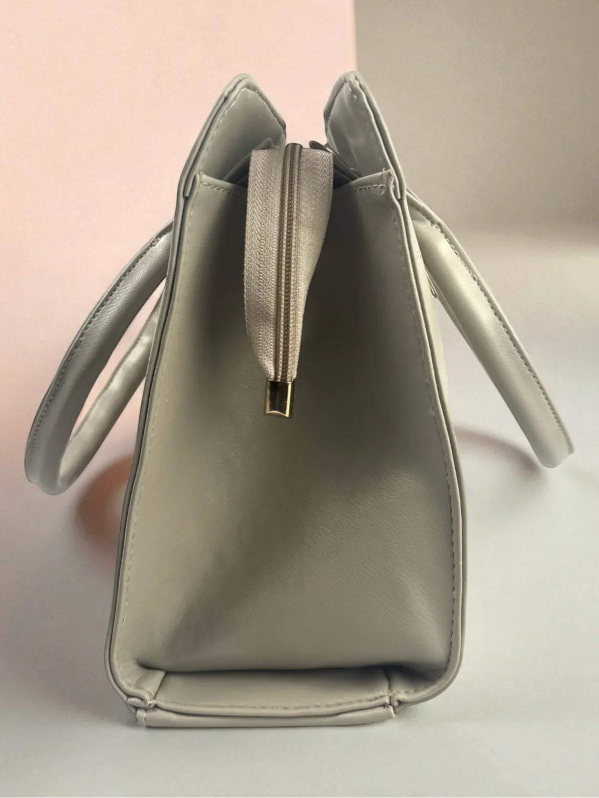 Tarani grey PU leather handbag side view showing spacious depth