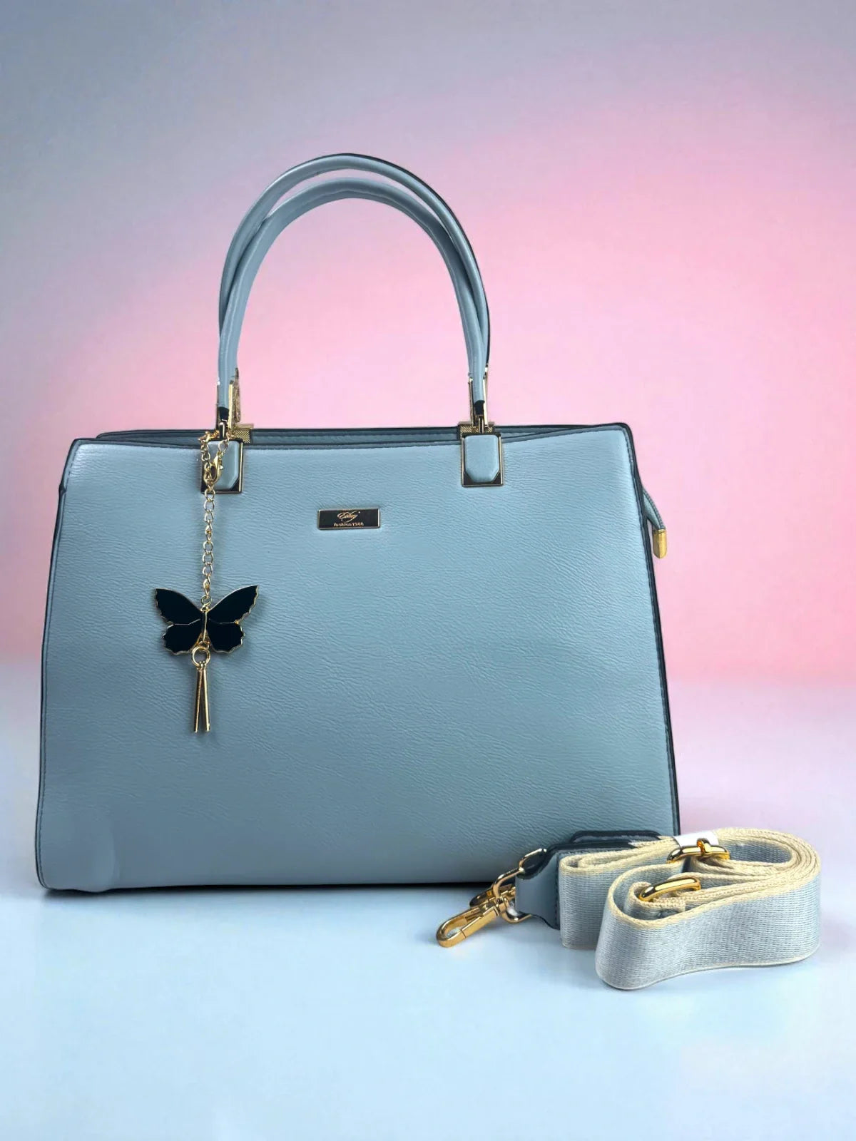 Tarani light blue PU leather handbag with gold accents, elegant design for office and festive use