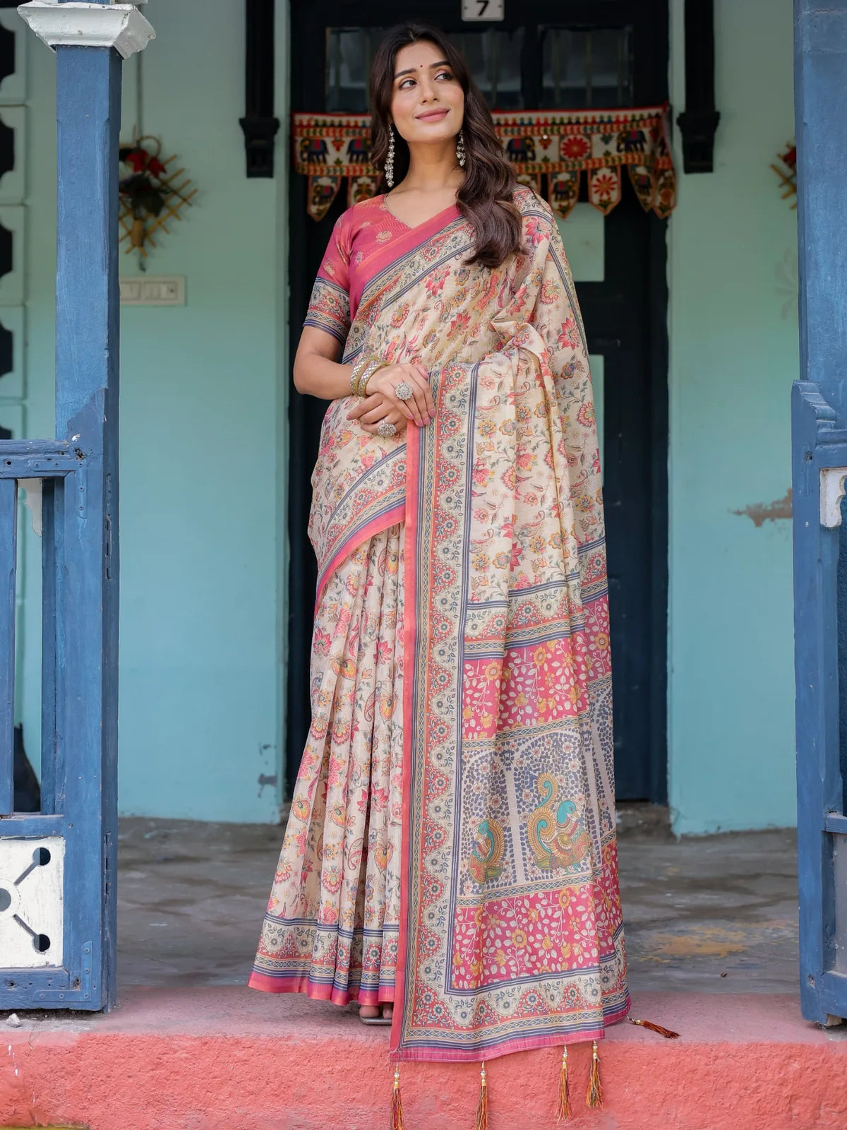 Tarani Shivika premium handloom beige floral saree full view with artistic pallu and tassels