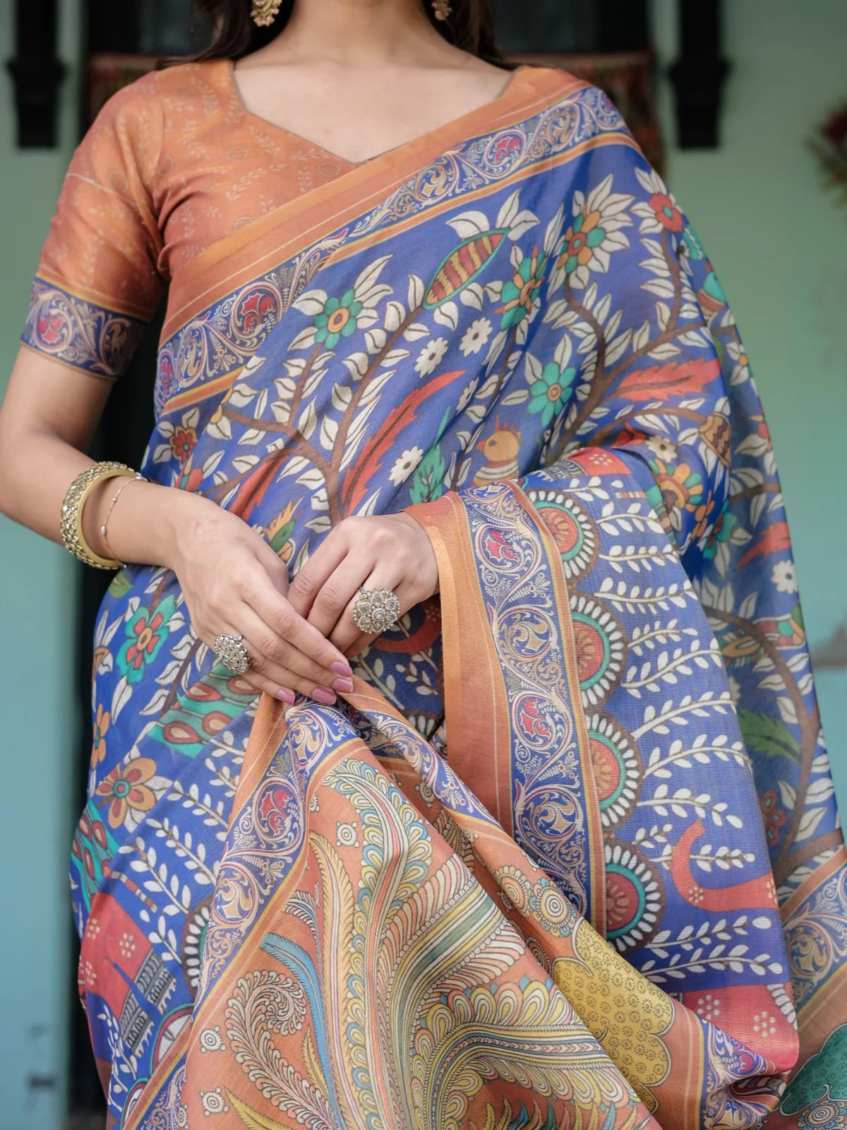 Tarani blue premium handloom saree closeup view showing floral motifs border and pallu art