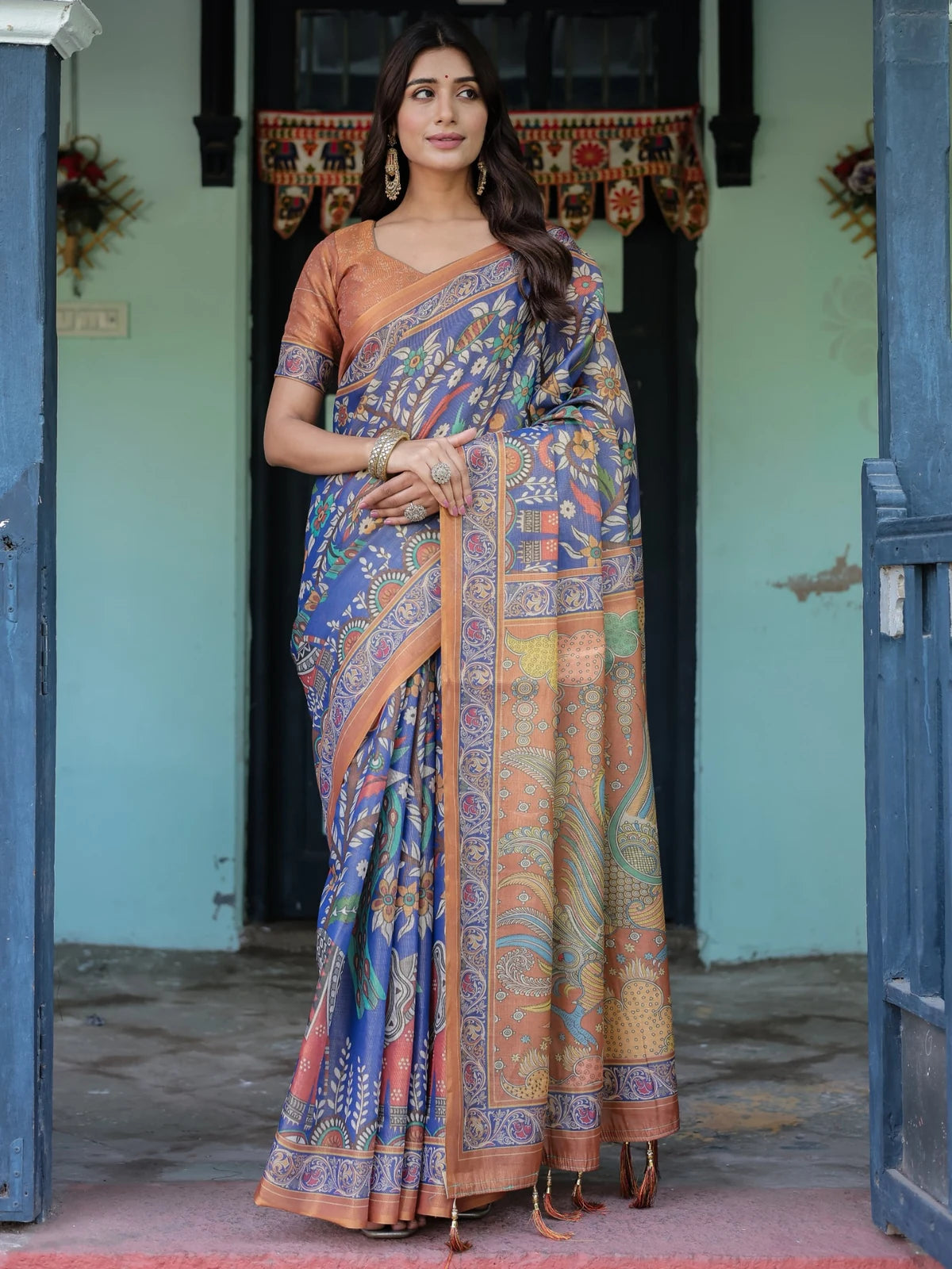 Tarani blue premium handloom saree full view with floral motifs heritage pallu and tassels