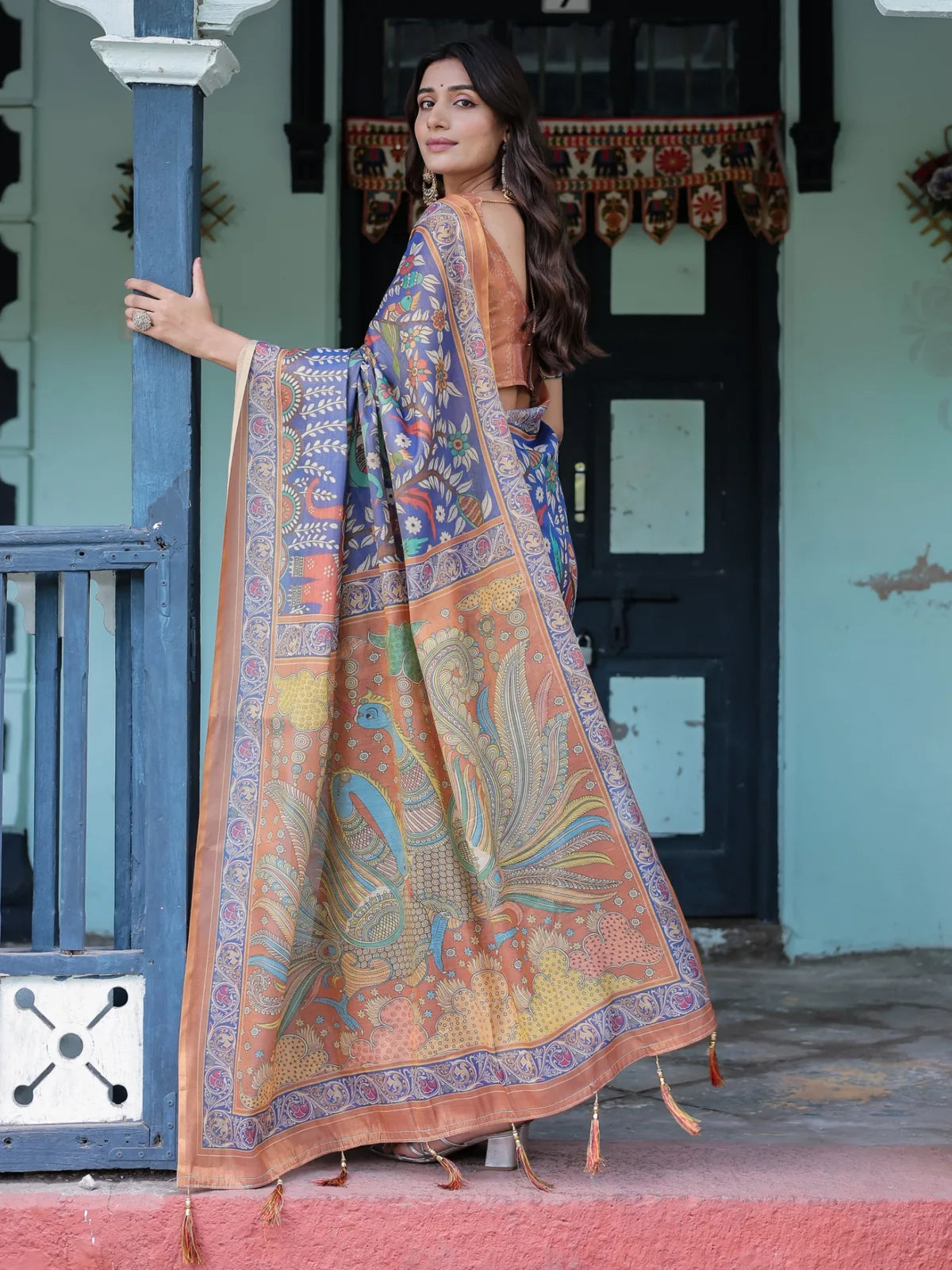 Tarani blue premium handloom saree pallu view with heritage artwork floral motifs and tassels