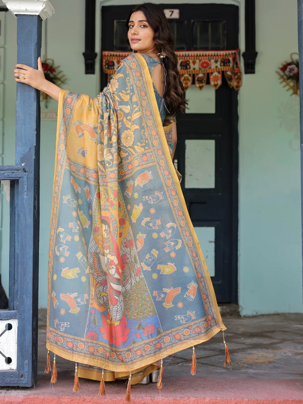 Tarani Hemashri premium handloom grey saree back view featuring artistic pallu tassels and heritage motifs