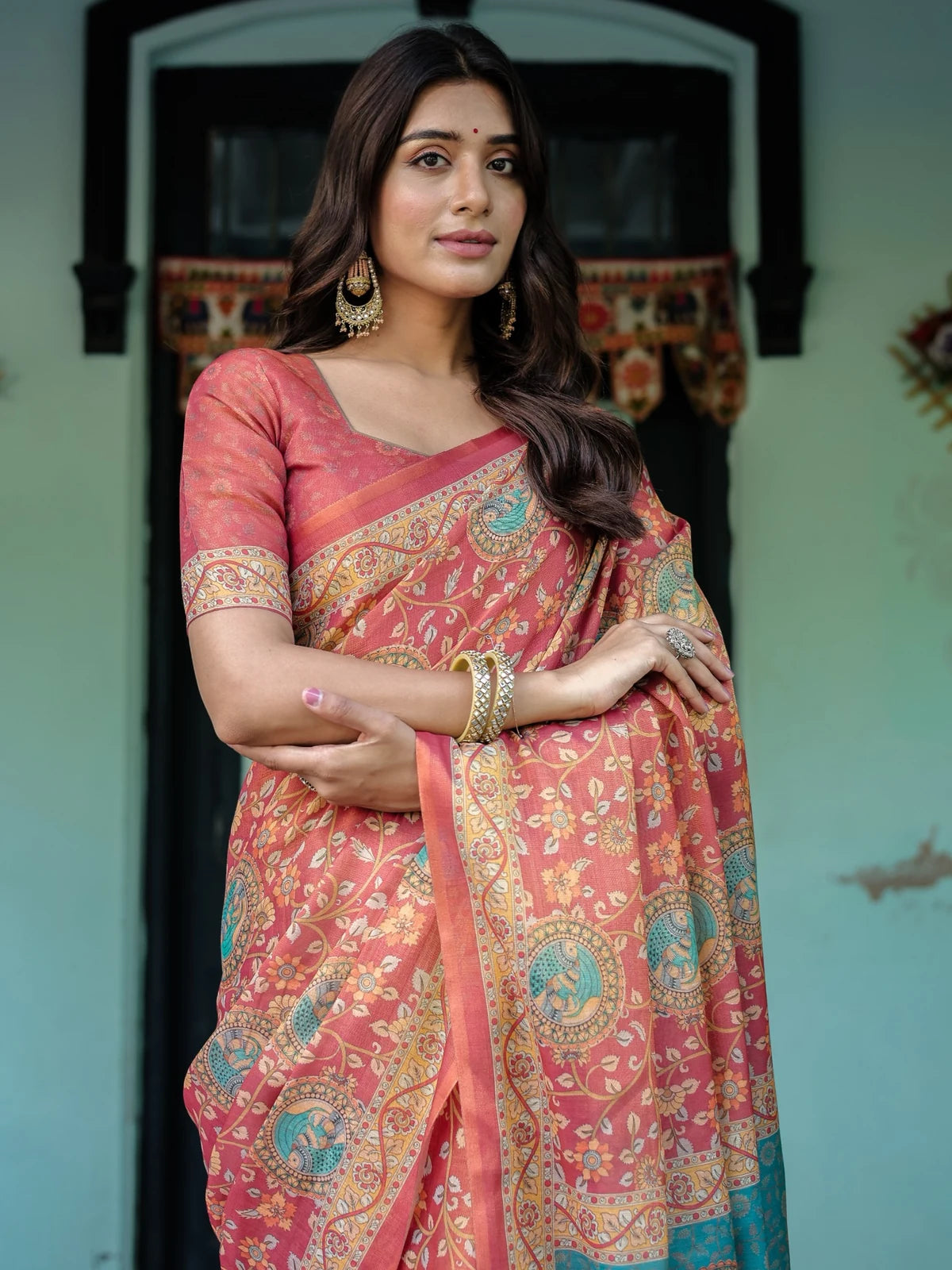 Tarani peach premium handloom saree upper body view with floral vine design and heritage border