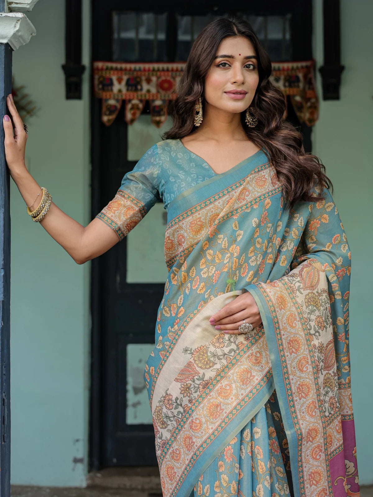 Tarani teal premium handloom saree upper body view with floral border and elegant blouse Lipisha