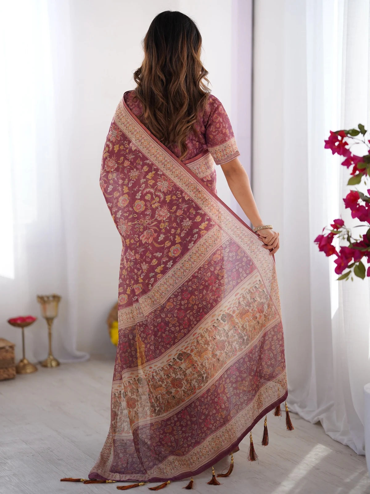 Tarani wine purple printed handloom saree back view with tassel pallu and floral motifs