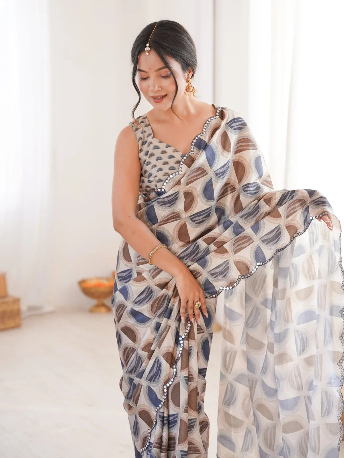 Tarani brown chinnon saree upper body view with printed blouse and mirror border detailing