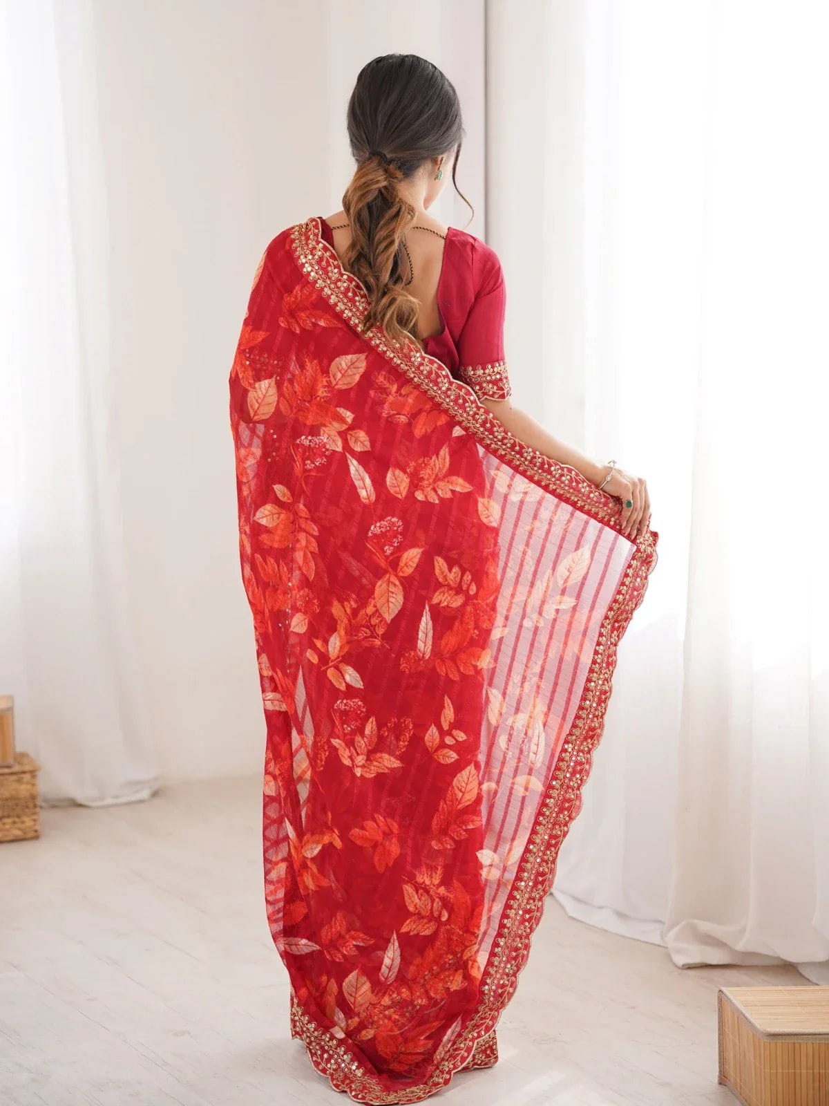 Tarani red saree back view with bold print and intricate border