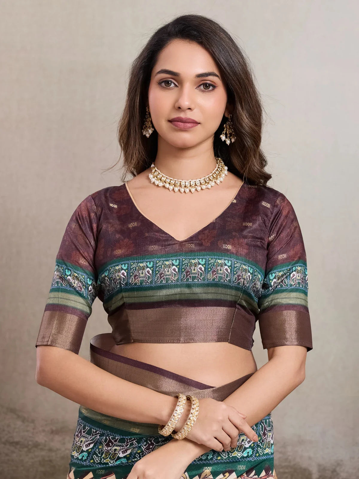 Tarani kalki silk saree close up showing upper body blouse and soft maroon color