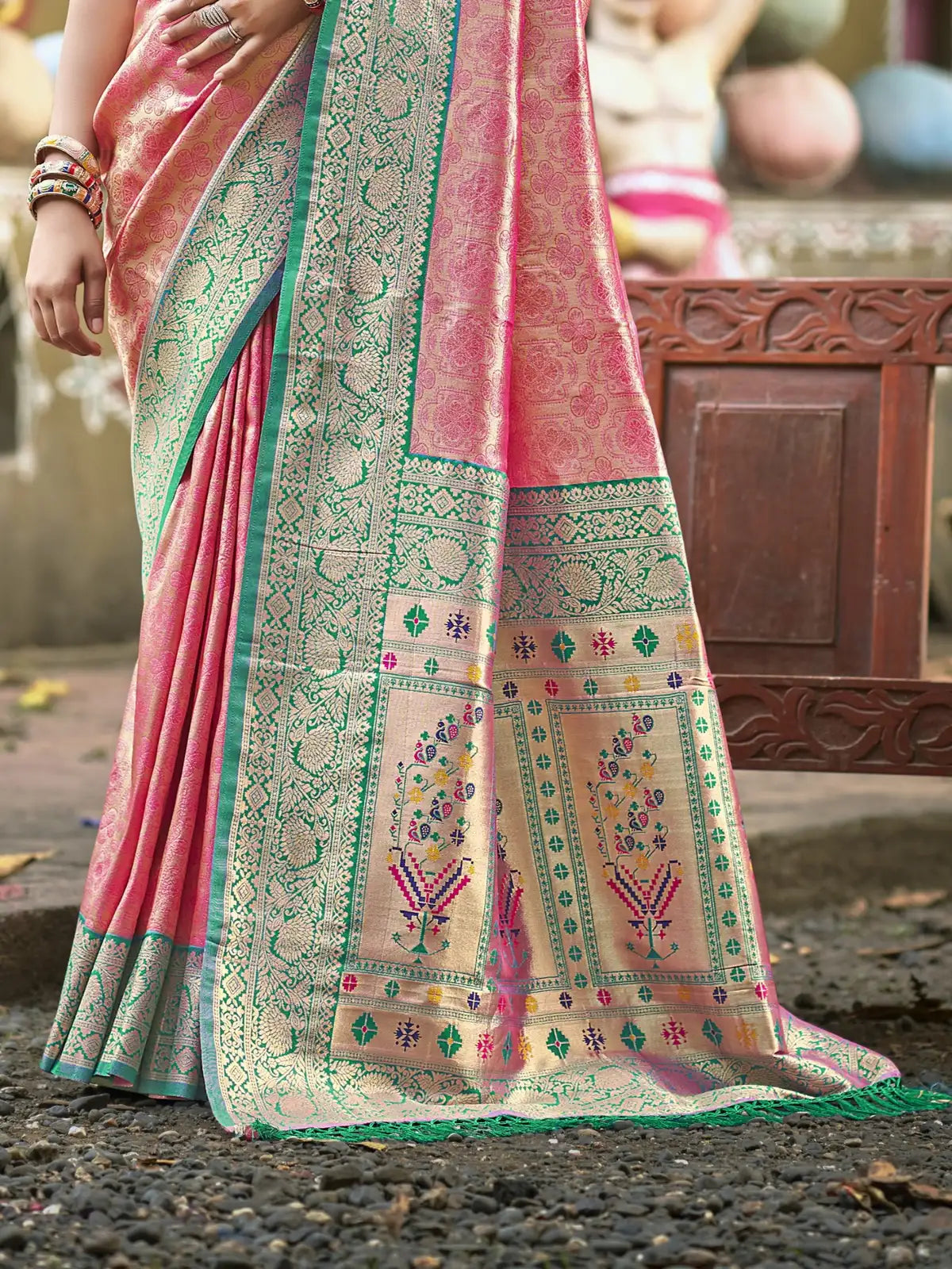Tarani pink kanjivaram silk saree pallu view showing intricate woven designs and border
