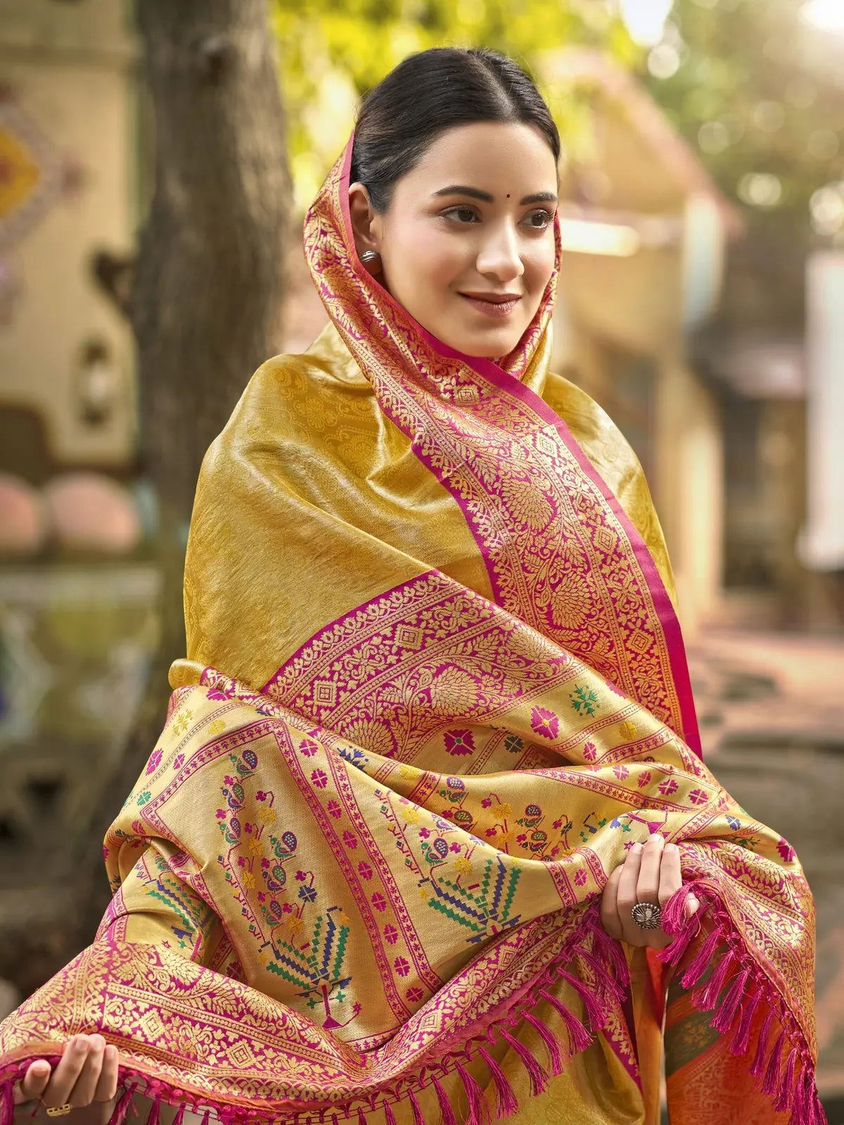 Tarani yellow Kanjivaram silk saree pallu view showing detailed woven border