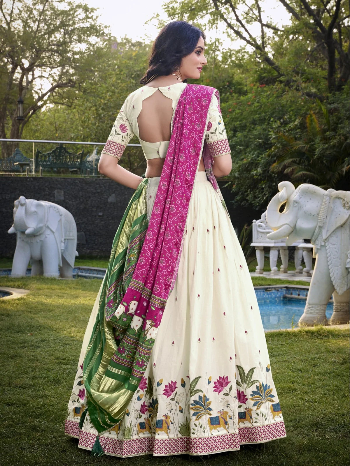 Tarani back view of cream embroidered khadi cotton lehenga and blouse with contrast dupatta