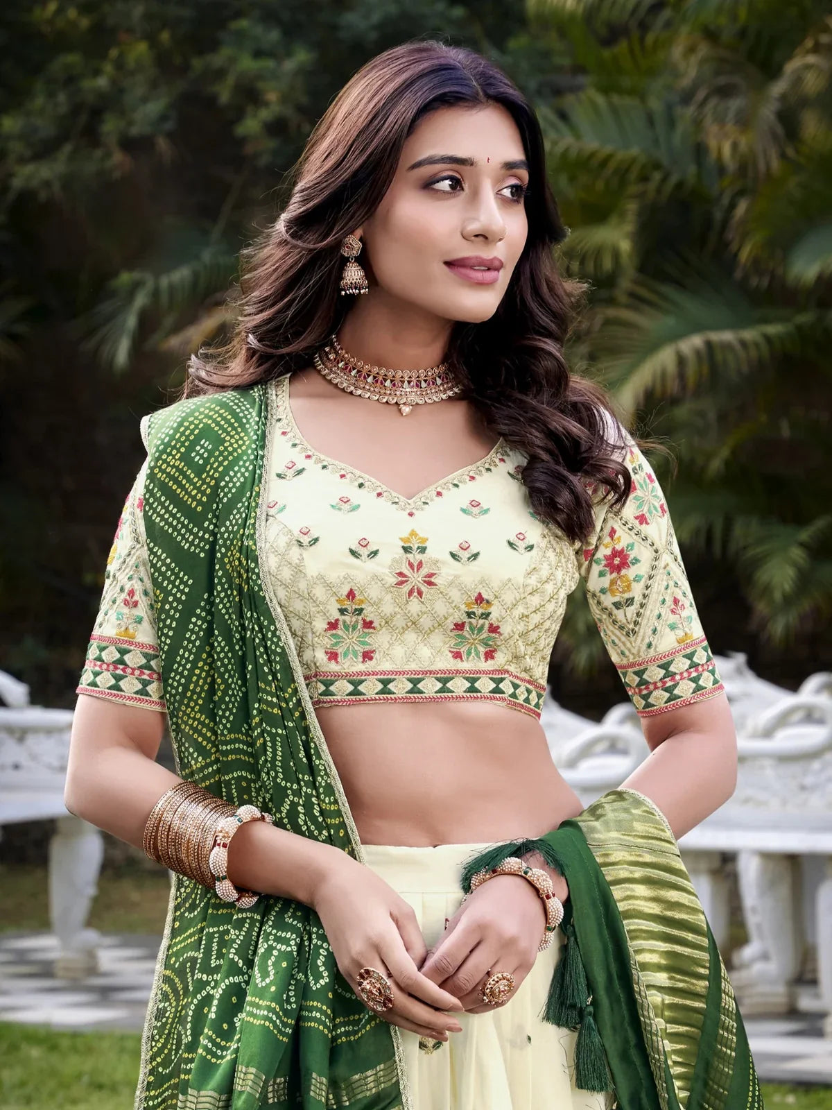 Tarani close-up of khadi cotton lehenga blouse with floral thread work and green dupatta