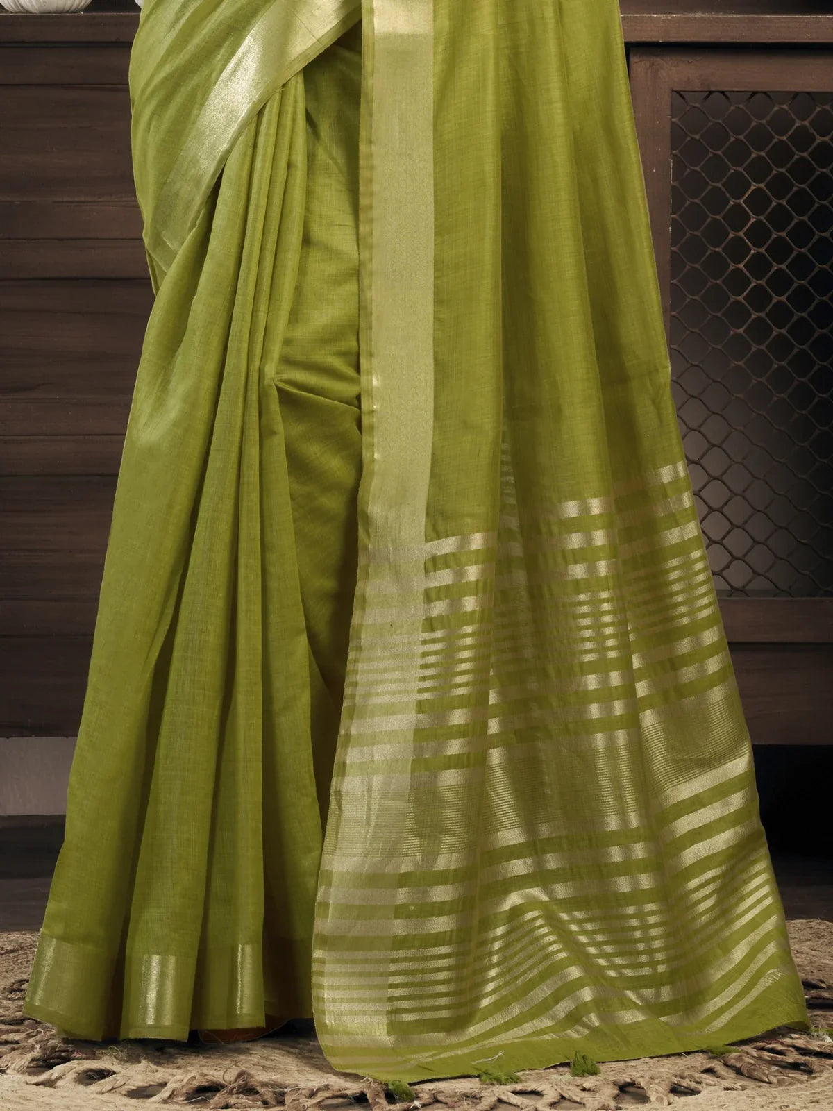 Tarani soft gold bordered pallu with striped design on green khadi cotton saree for uniform use