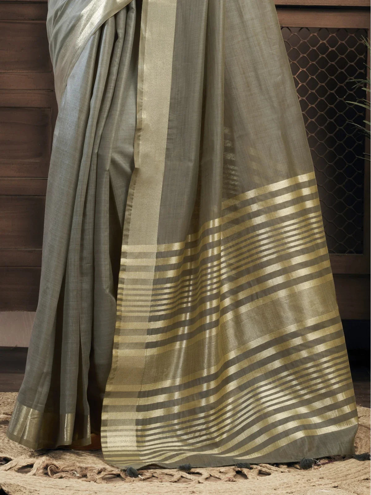 Tarani classic pallu view of grey khadi cotton saree with striped border and soft finish