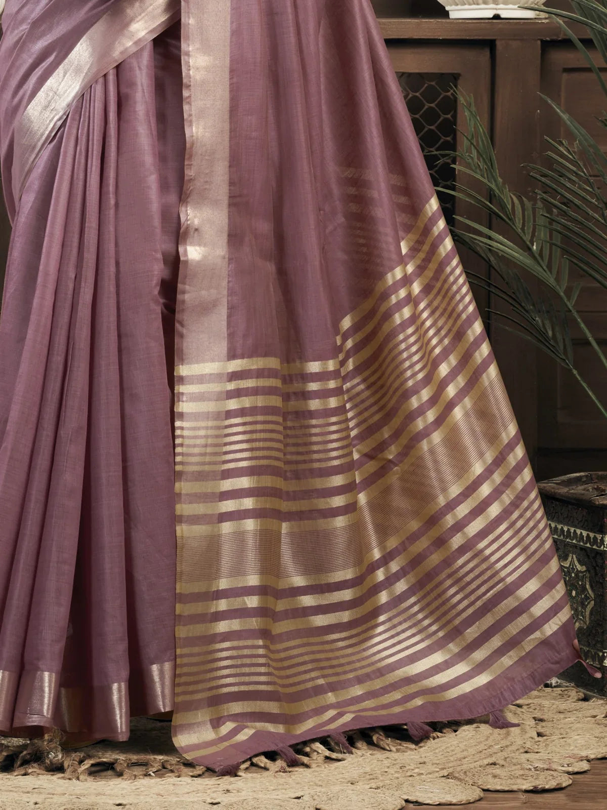 Tarani khadi cotton saree pallu view with striped golden zari detailing and lavender base