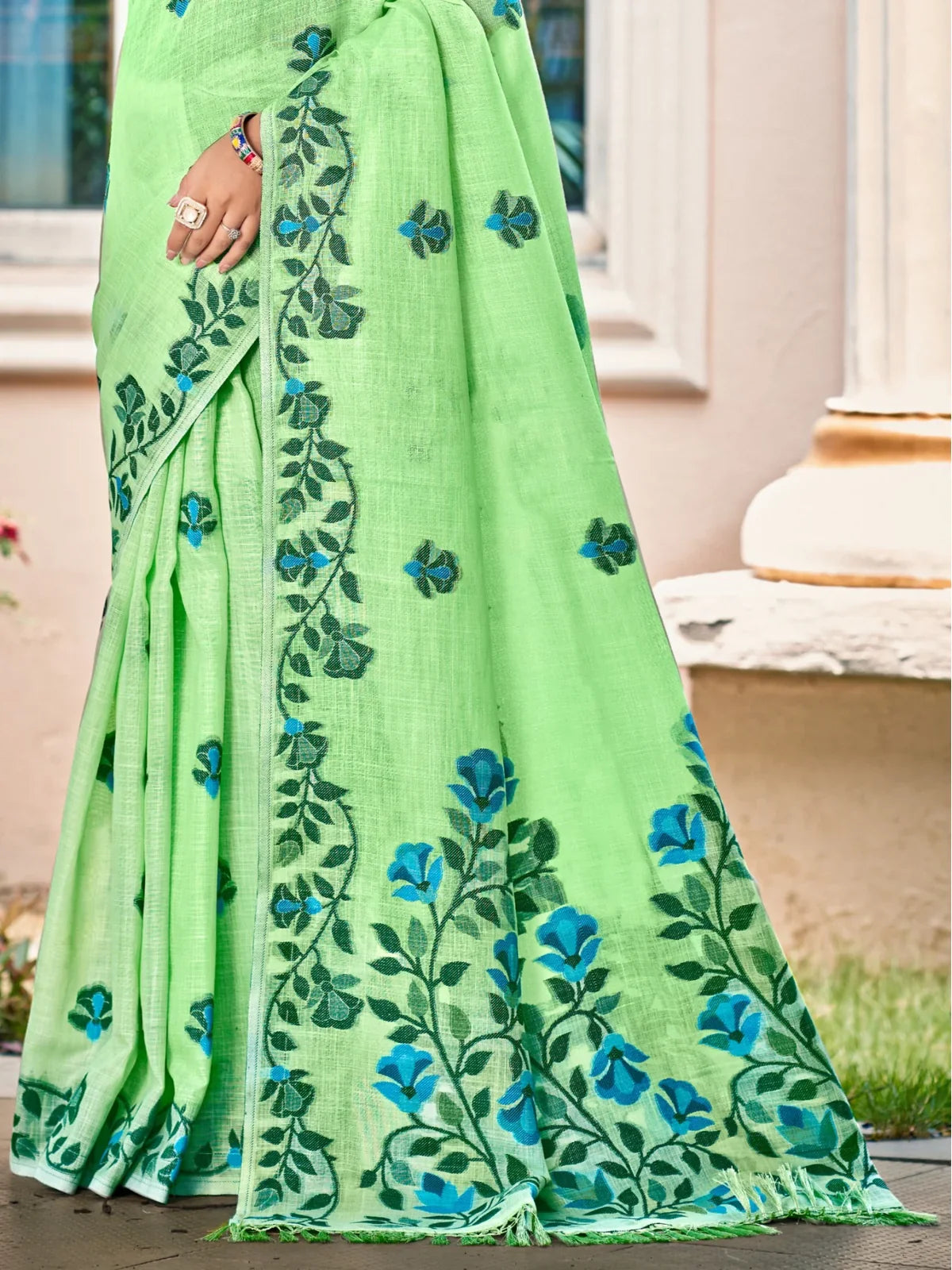 Tarani light green Lilen saree pallu closeup with detailed embroidery pattern
