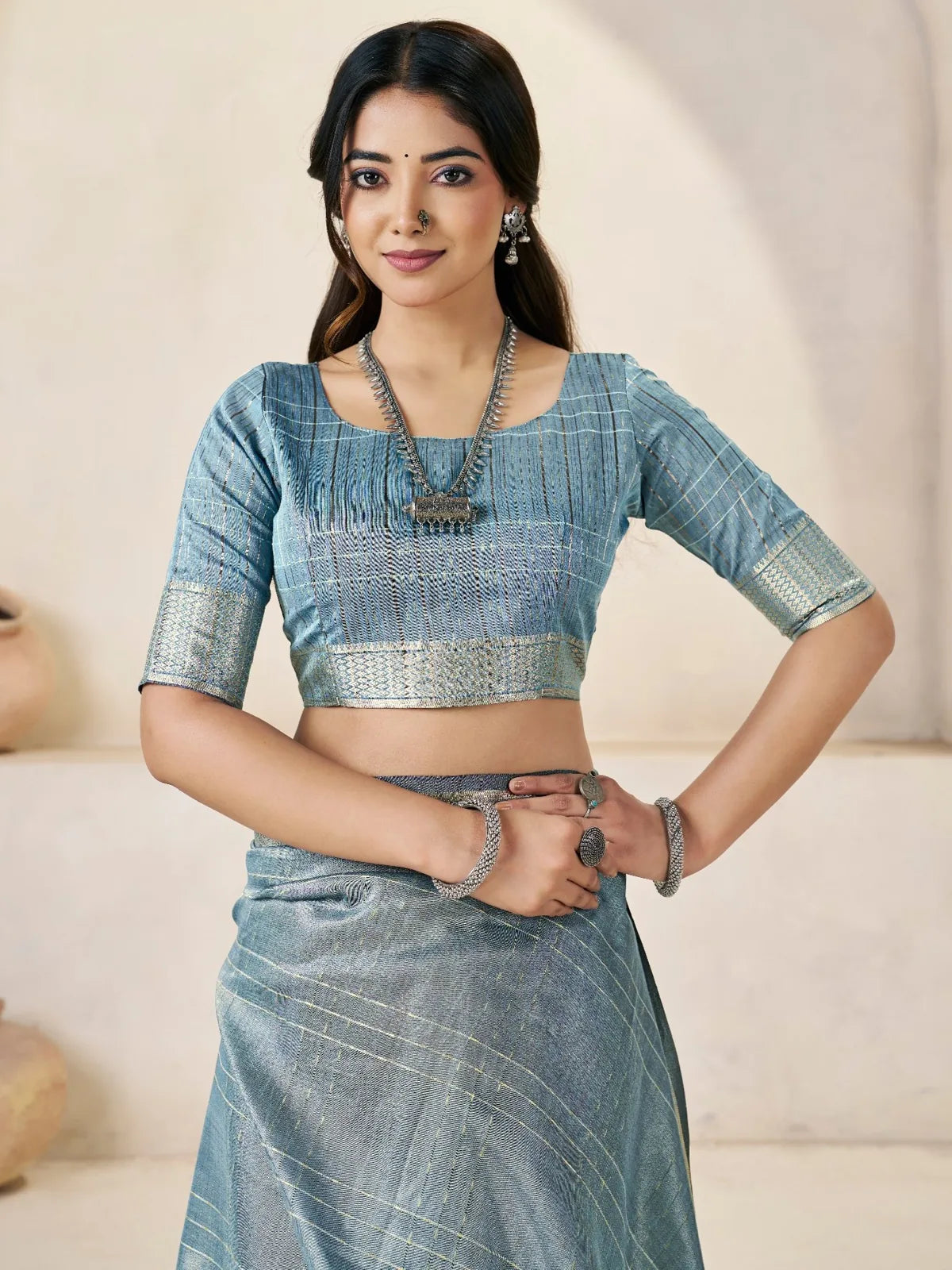 Tarani blue linen cotton silk saree blouse and upper body view with zari detailing