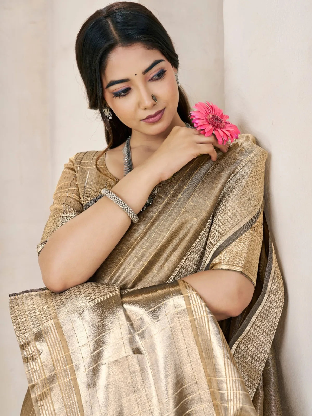 Tarani golden saree closeup view highlighting border and zari work