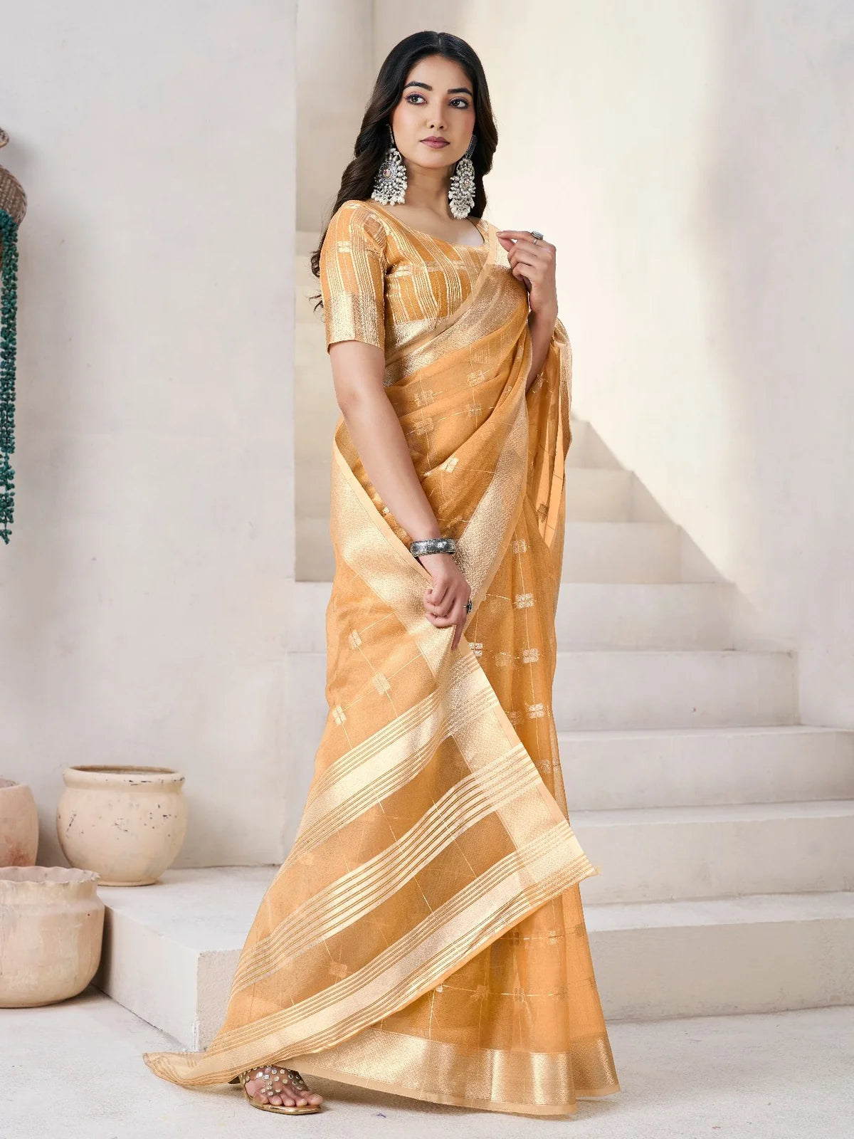 Tarani golden soft linen cotton silk saree elegant side view with shimmering zari border