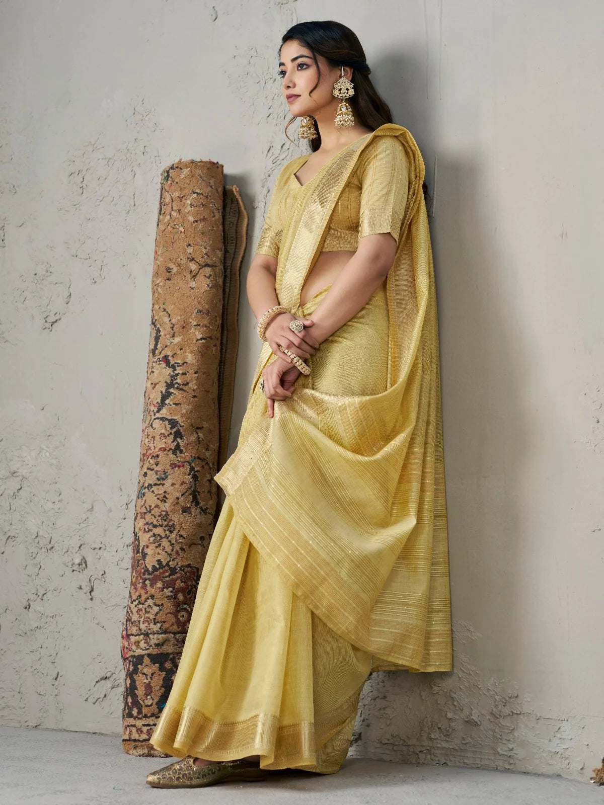 Tarani golden soft linan cotton silk saree side view with elegant drape and shimmering border