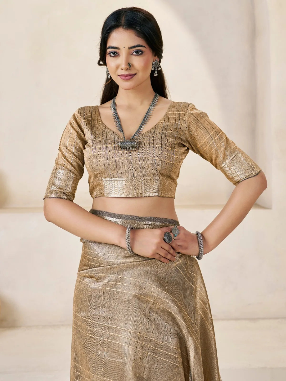 Tarani golden saree upper body view showing blouse and zari detailing