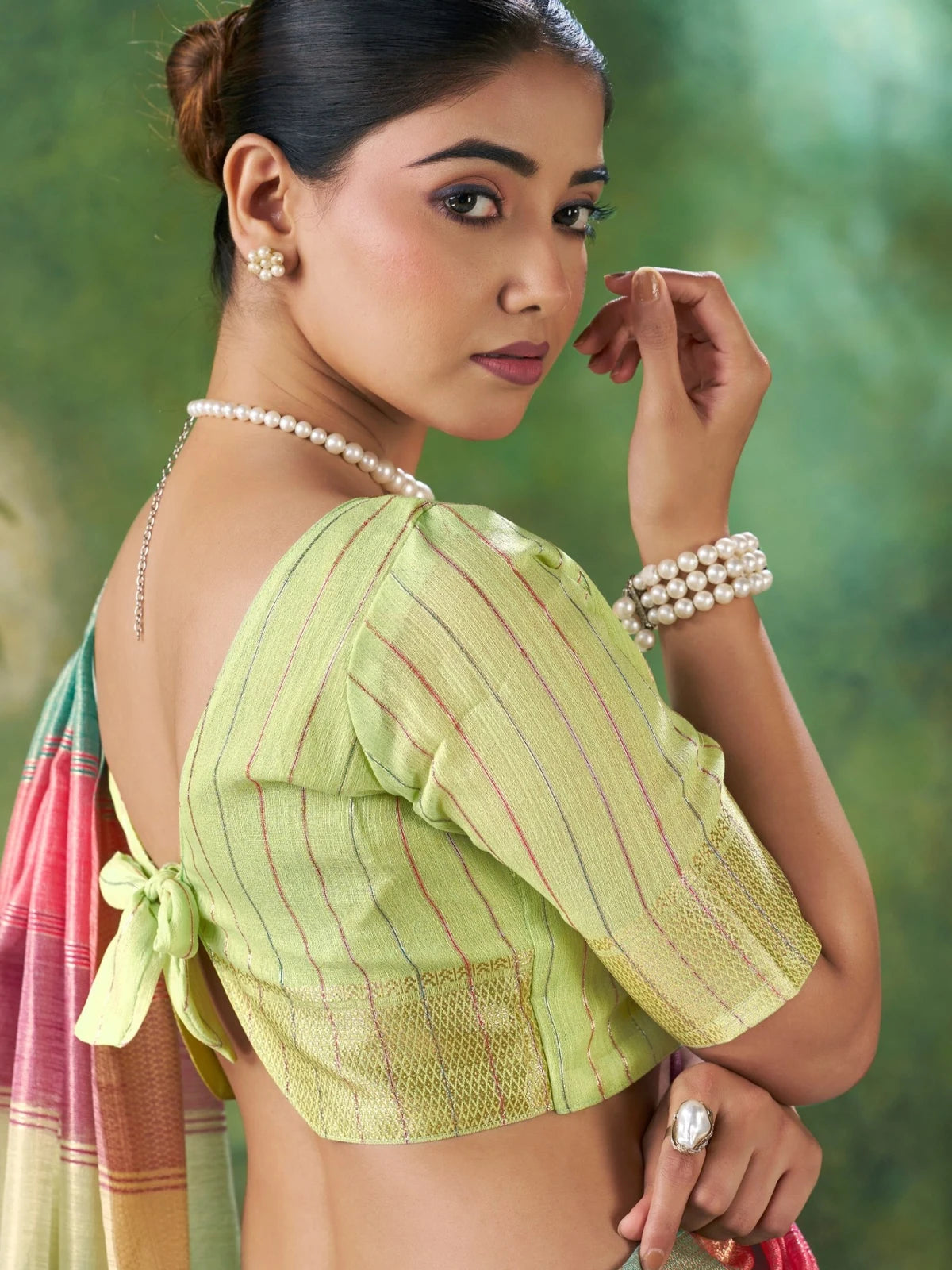Tarani Falguni green blouse view with zari work and designer blouse styling