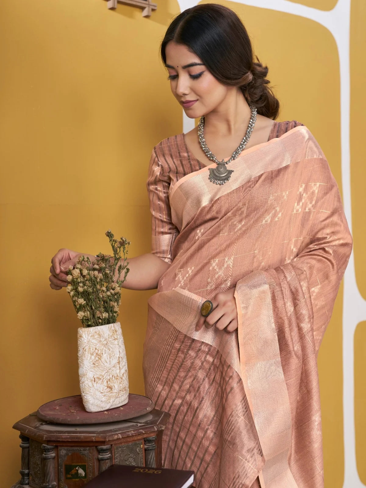 Tarani peach zari work saree pallu view with elegant woven border detailing by Tarani