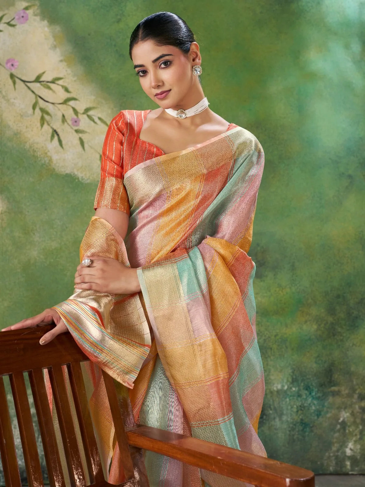 Tarani peach zari work saree pallu view with shimmering woven border and festive styling