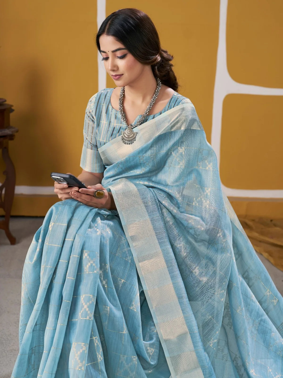 Tarani sky blue party wear saree pallu view with woven zari border and texture details