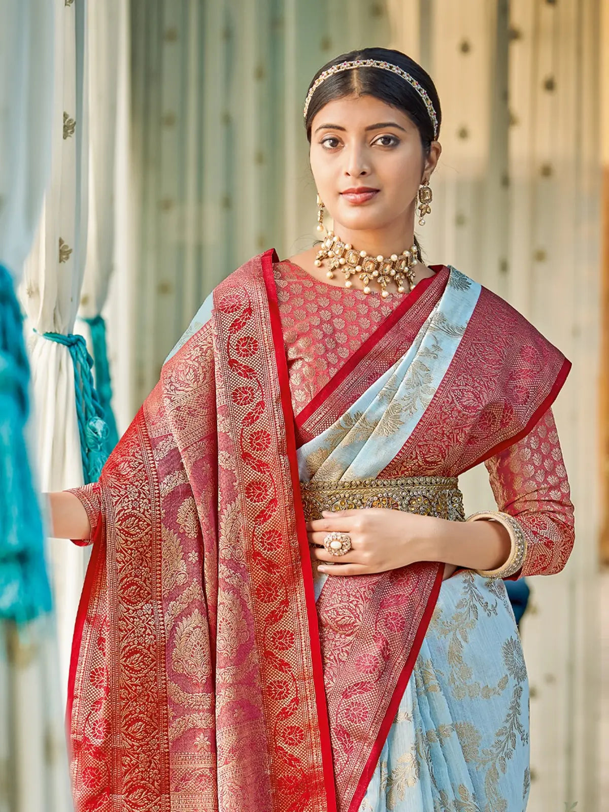 Tarani linen cotton saree upper body view showing rich red border and zari work