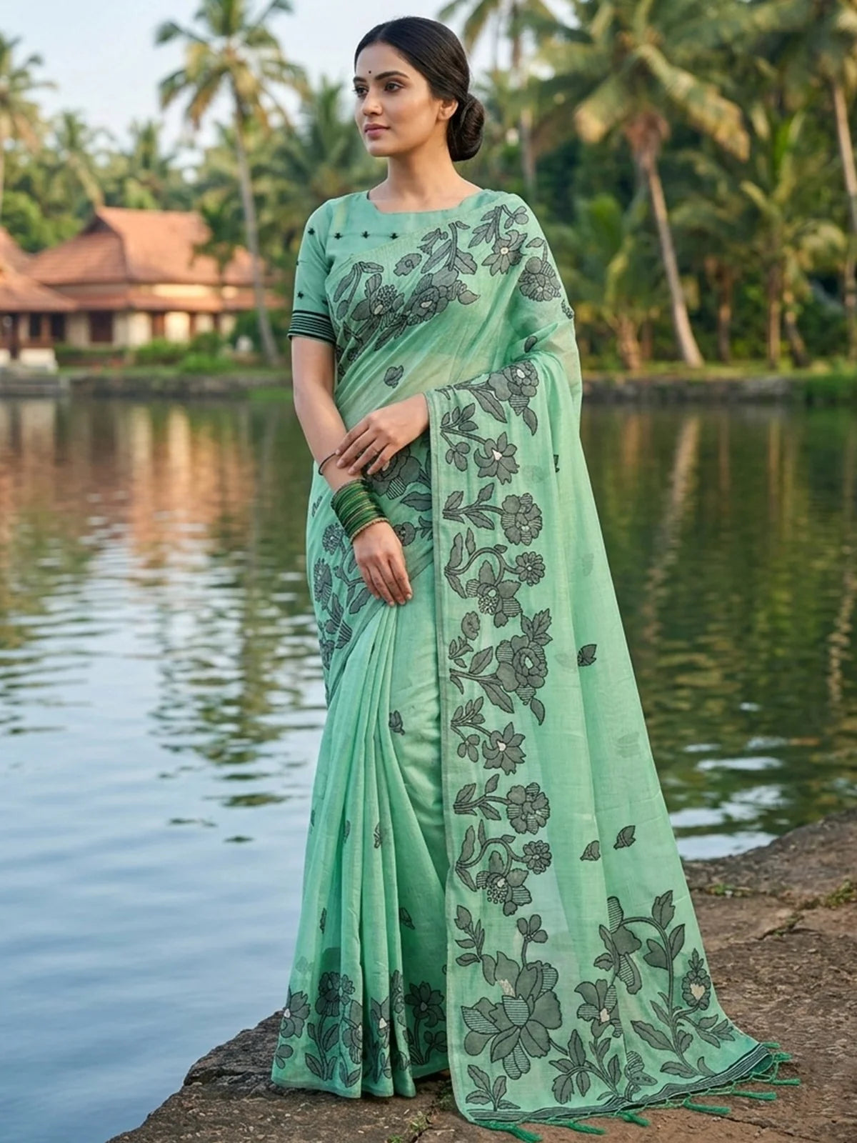 Tarani mint green linen cotton printed saree front view with floral design and blouse piece for festive occasions