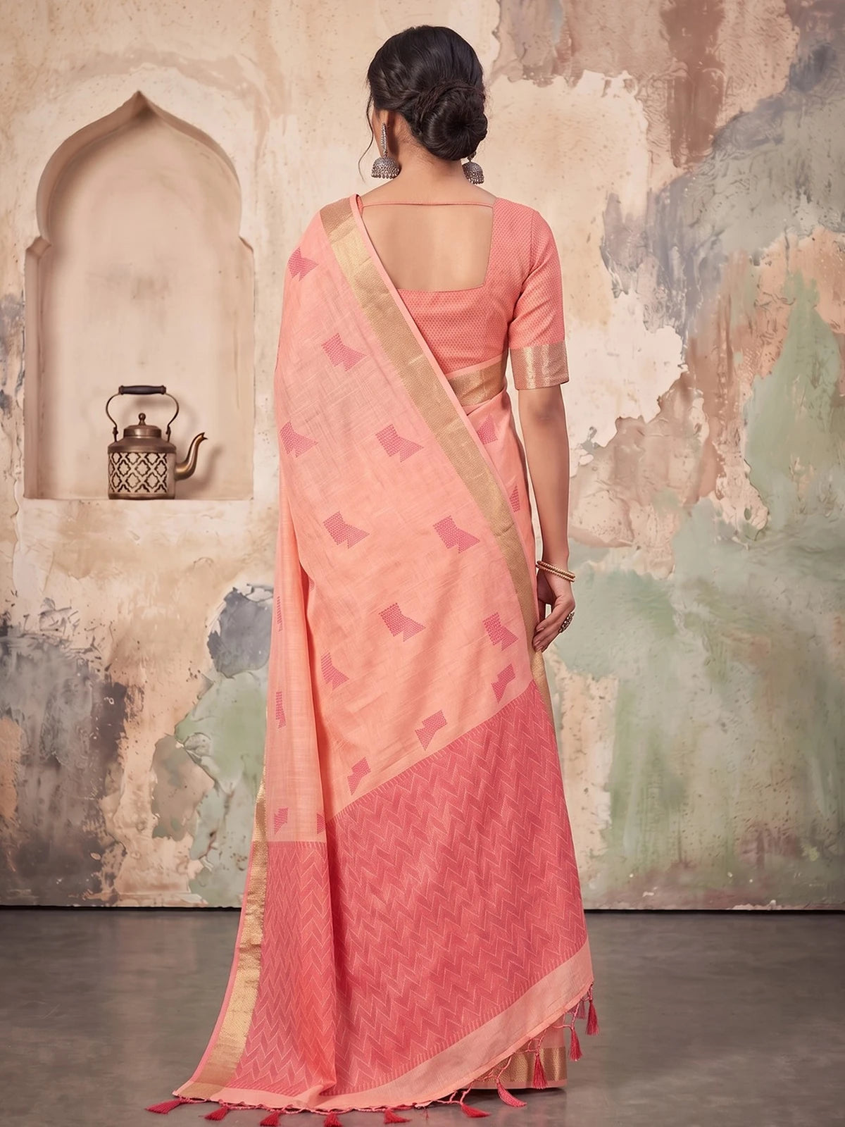 Tarani peach linen cotton saree back view with woven pallu and tassels