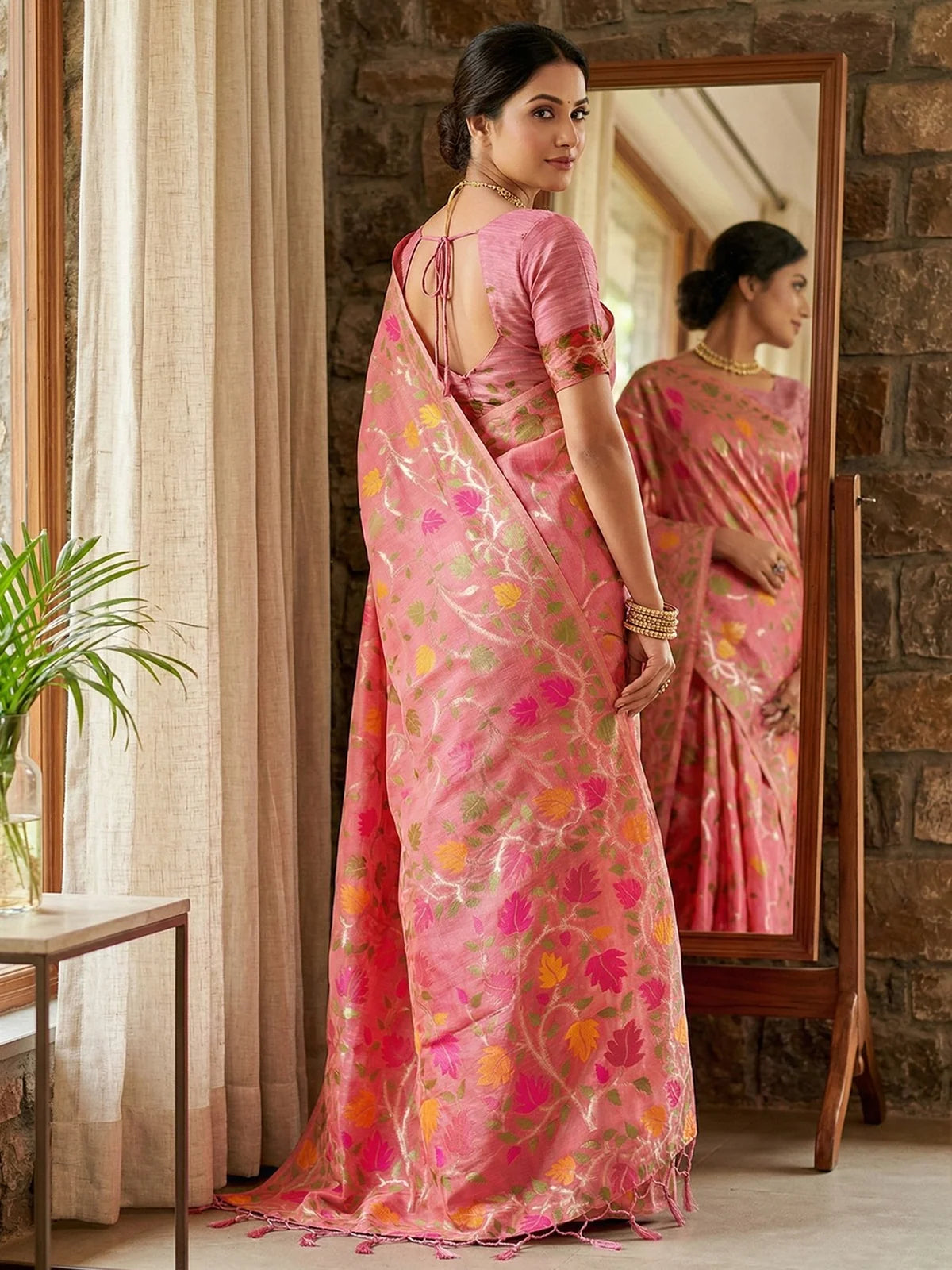 Tarani Jasika pink Linen Cotton saree back view featuring woven floral motifs and elegant blouse design