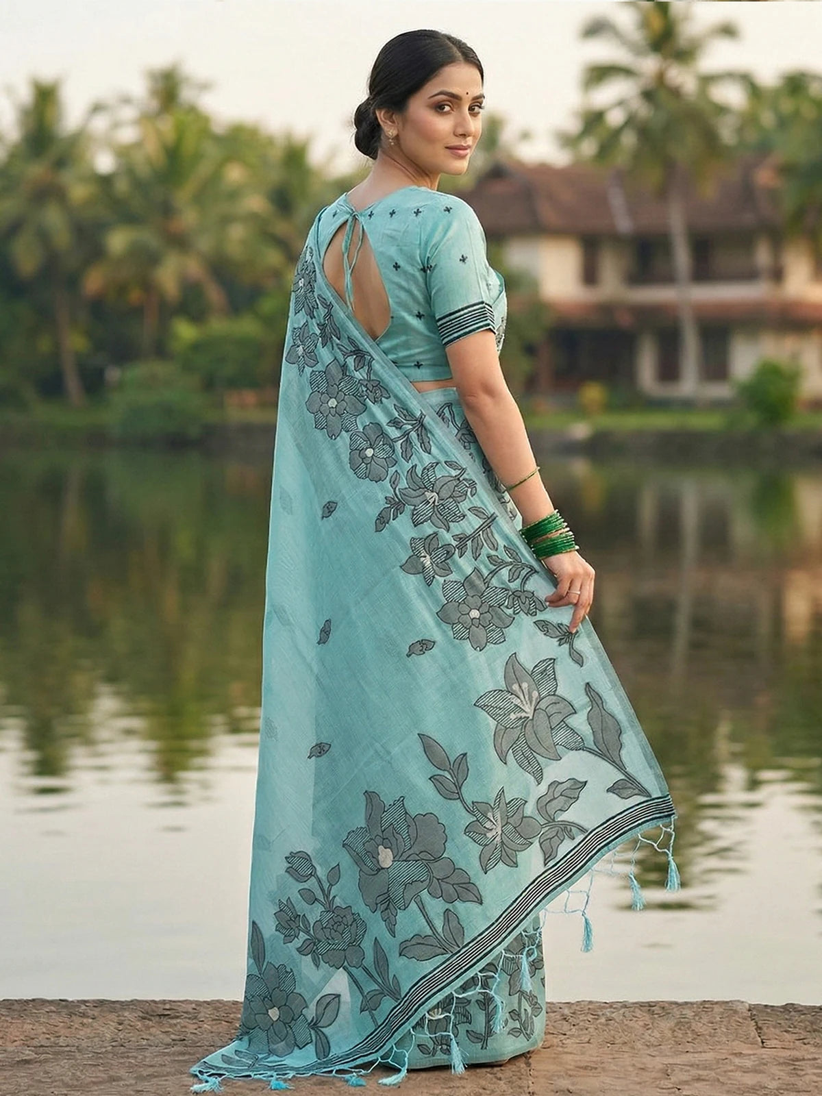 Tarani sea green linen cotton saree back blouse and pallu view with floral printed design