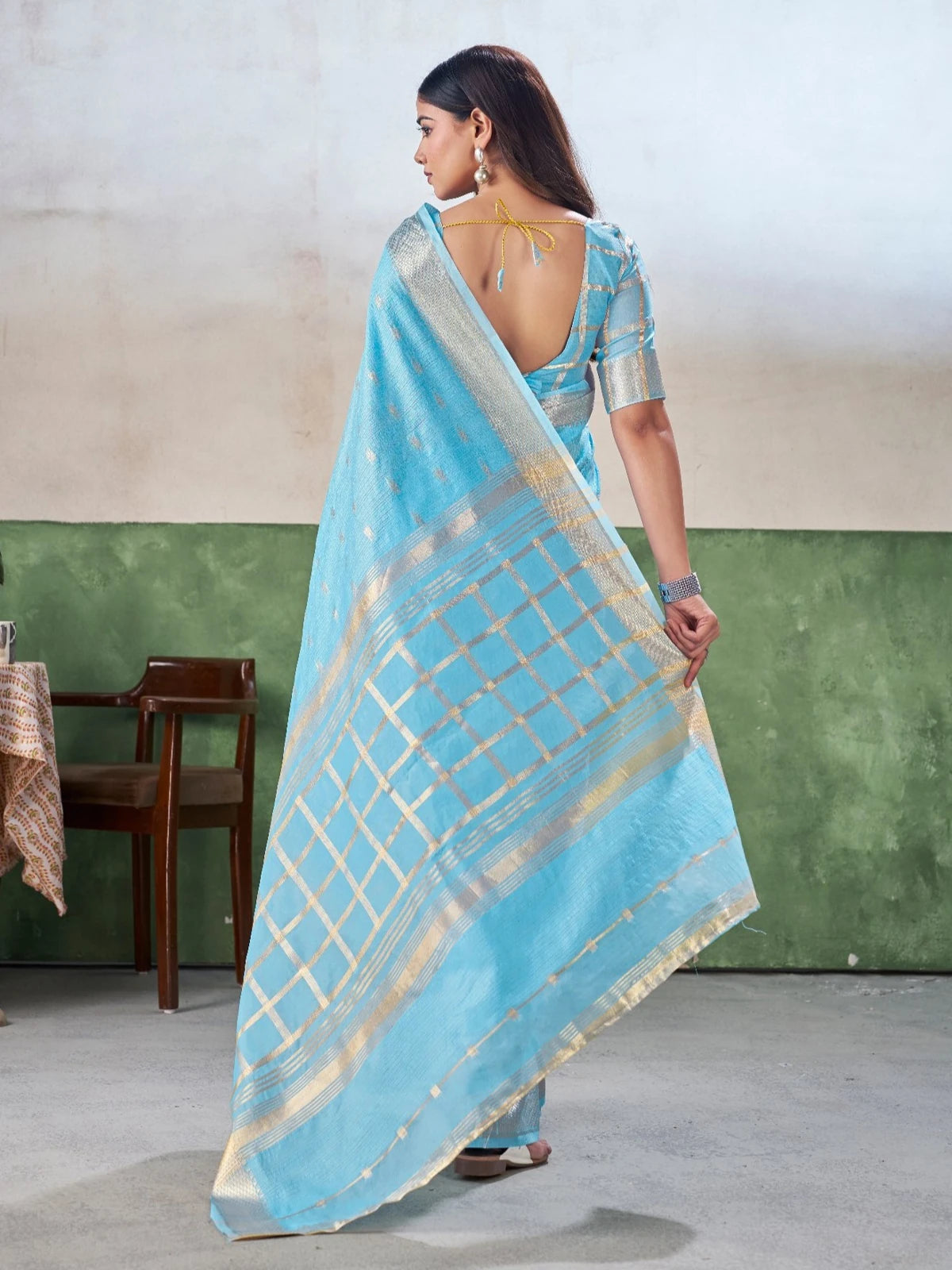 Tarani sky blue saree back view showcasing blouse back pattern and pallu