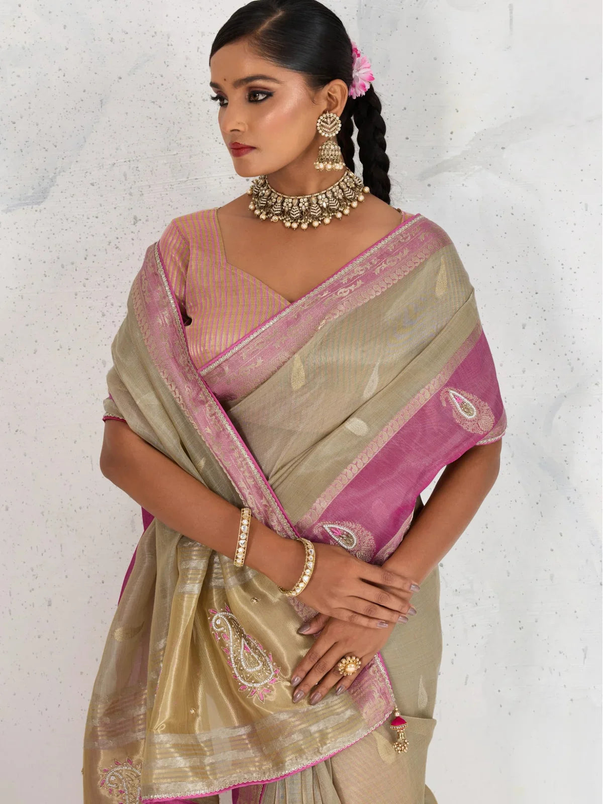 Tarani beige linen saree upper body view paired with contrast blouse with handwork sleeves
