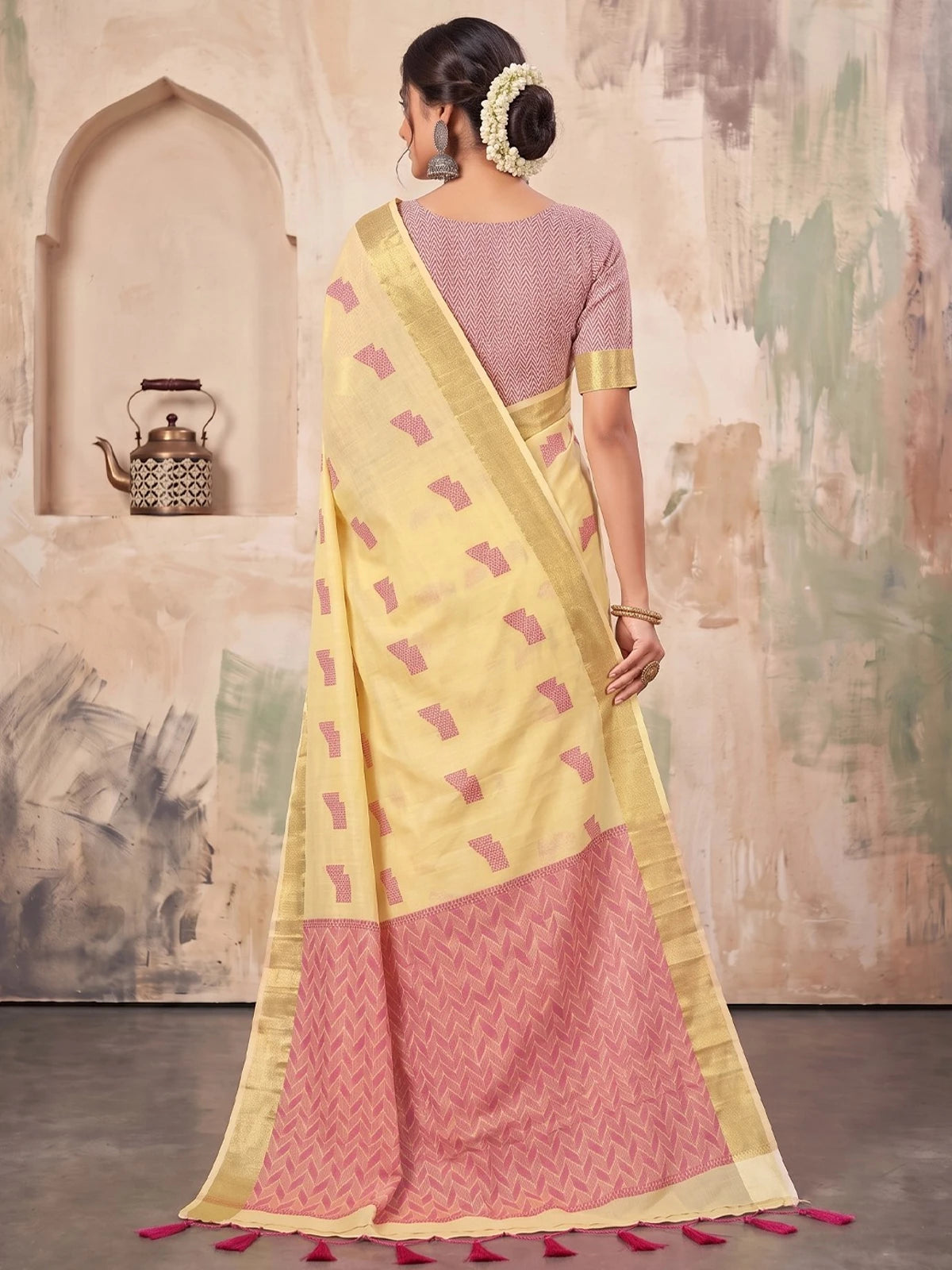Tarani cream linen cotton saree back view with woven pallu and tassels