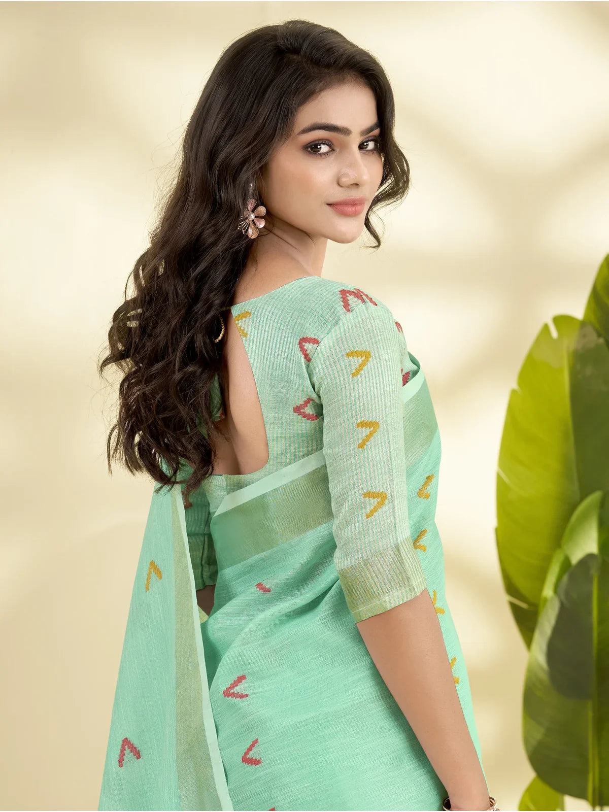 Tarani green linen silk saree with zari blouse back design close-up