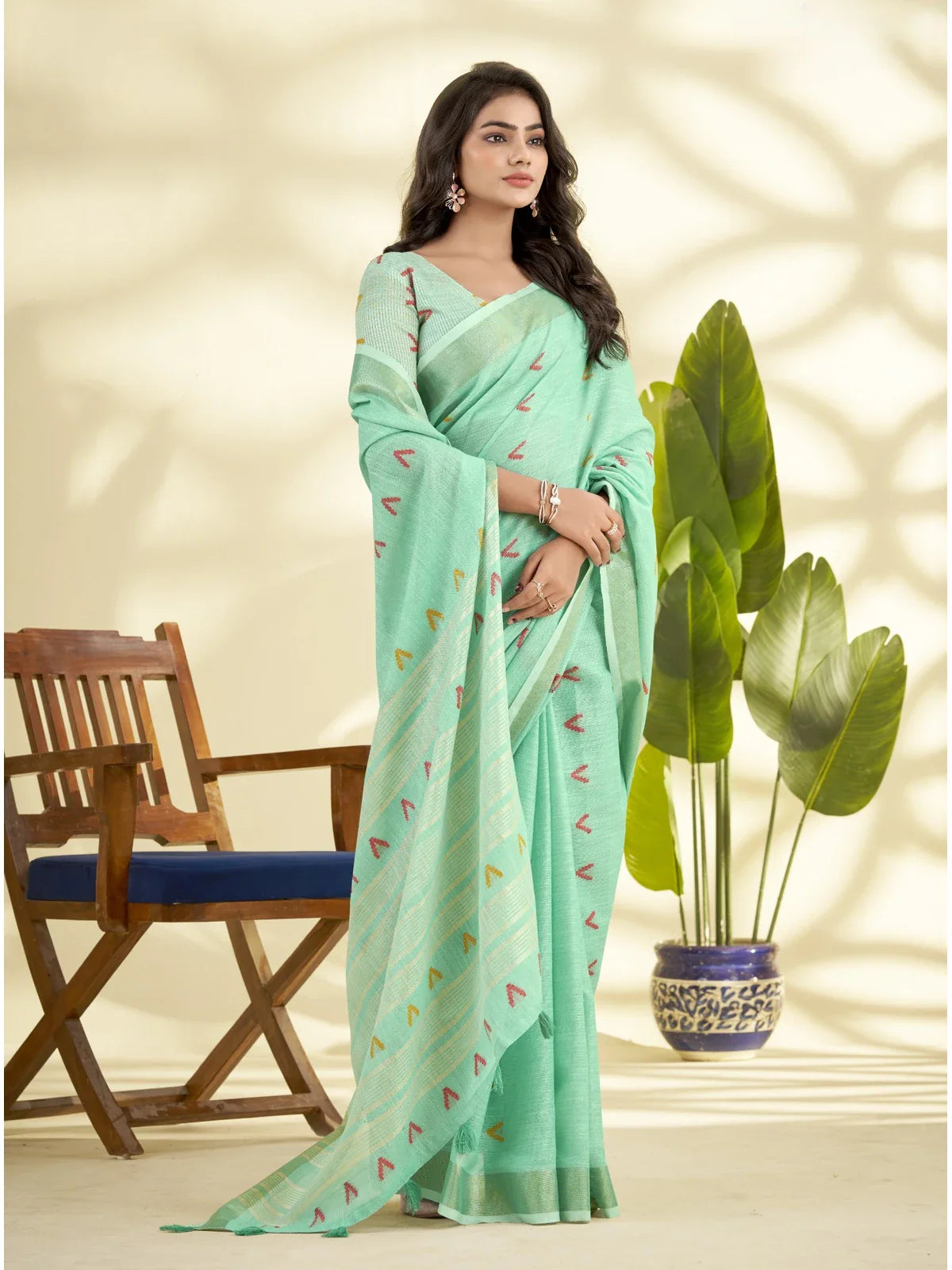 Tarani green linen silk saree with subtle texture and soft drape front pose