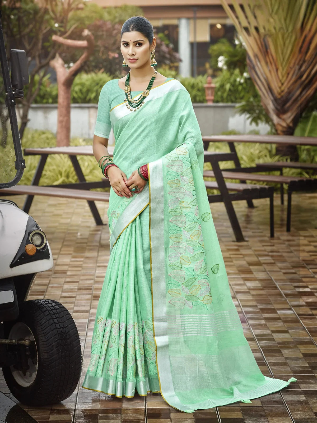 Tarani green linen saree with embroidered border and blouse full view