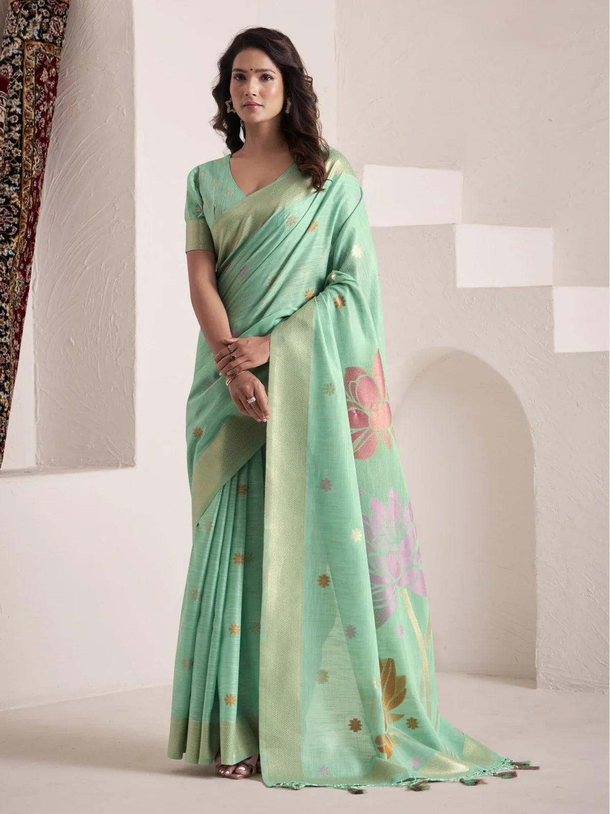 Tarani premium green soft linen saree with big jacquard pallu and butti work perfect for festive and party wear
