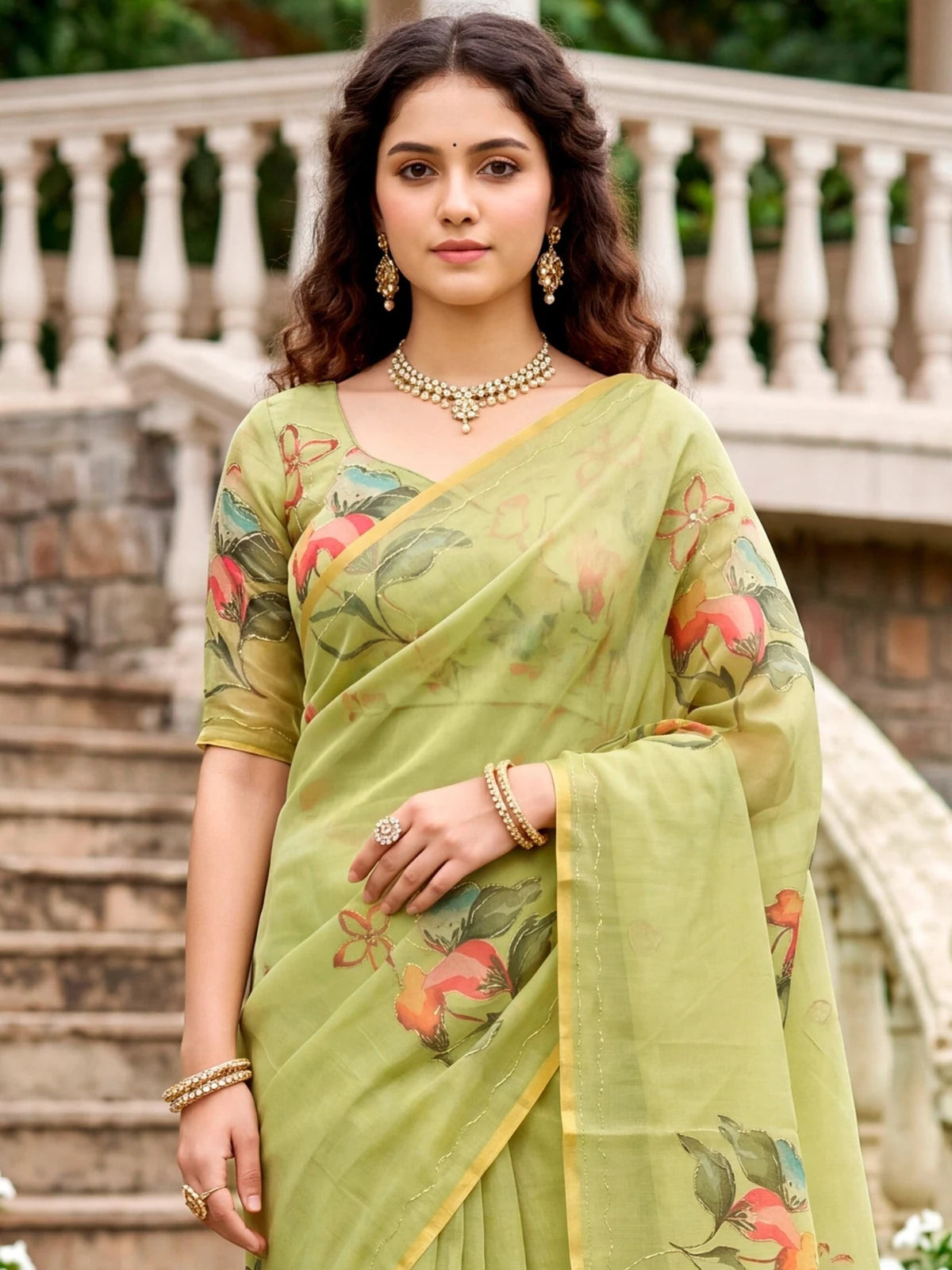 Tarani Aahnika green linen cotton print saree upper body view with floral blouse and elegant Aari detailing
